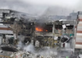 Firefighters work in ruins of a mall damaged in Russia's most massive missile attack in Dnipro, Ukraine.(AP)