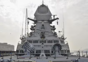 Sailors stand next to anti-submarine launchers on the INS Imphal ahead of its commissioning. (PTI)