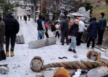 A torii gate is damaged after an earthquake at a shrine in Kanazawa, Ishikawa prefecture, Japan (AP)