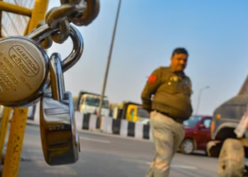 A police barricade secured with locks at Ghazipur border in view of farmers' protest march, in Ghaziabad, Thursday, Feb. 15, 2024. (PTI Photo)