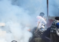 Security personnel fire tear gas shells to disperse protesters trying to remove barricades at the Shambhu border.