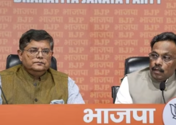 BJP national general Secretary Vinod Tawde (right) announces the party’s first list of candidates for the upcoming Lok Sabha elections at a press conference in New Delhi on Saturday. (PTI)