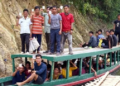 Voters on their way to polling station to cast their votes via boat for the second phase of Lok Sabha Polls at Korbuk in East Tripura on Friday. (ANI)