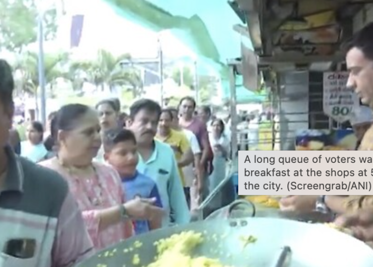 A long queue of voters was seen getting breakfast at the shops at 56 Dukan Market in the city. (Screengrab/ANI)