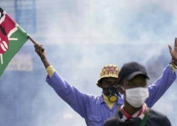 An anti-government protester waves a Kenyan flag