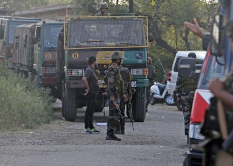 Kathua: Security forces stand guard near the site of an encounter between security forces and terrorists.
