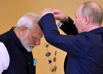 Russian President Vladimir Putin decorates Indian Prime Minister Narendra Modi with the Order of St. Andrew