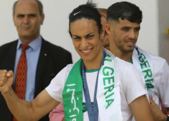 Gold medalist in the the women's 66 kg boxing Algeria's Imane Khelif, left, and bronze medalist in the men's 800m Djamel Sedjati arrive after the 2024 Summer Olympics