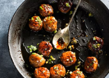 This image released by Milk Street shows a recipe for Japanese chicken meatballs. (Milk Street via AP)