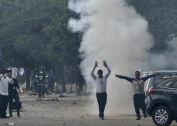 Police fire tear gas shell to disperse the protesters during a protest march in Manipur’s Imphal on September 10. (REUTERS)