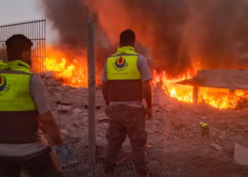 Rescuers rush to the scene of an Israeli airstrike that targeted the southern Lebanese village of Abbasiyeh on September 24, 2024.(AFP)