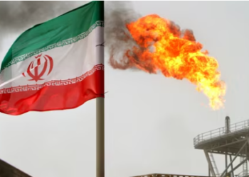 A gas flare on an oil production platform is seen alongside an Iranian flag in the Gulf.(REUTERS File)