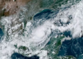 This handout satellite image courtesy of the National Oceanic and Atmospheric Administration (NOAA) and the Regional and Mesoscale Meteorology Branch (RAMMB) shows hurricane Milton churning over the Gulf of Mexico, on October 6, 2024. Storm Milton became a hurricane on October 6, the National Hurricane Center said, as it barrelled toward the western coast of Florida -- still recovering from the aftermath of devastating Hurricane Helene. "Air Force hurricane hunters find Milton rapidly intensifying into a hurricane," the NHC said in an advisory, putting the storm's maximum sustained winds at 80 miles (130 kilometers) per hour, classifying it as a Category 1 hurricane. It said the storm was some 815 miles from Tampa, Florida, and could arrive there by midweek as a major hurricane. (Photo by NOAA / AFP)