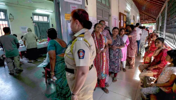 Maharashtra election live: Voters waiting in a queue to cast their votes for Maharashtra Assembly election 2024 at a polling station in Mumbai on Wednesday.