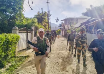 Security personnel conduct patrolling in a sensitive area of Manipur on Wednesday. (PTI)