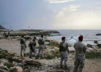 Lebanese soldies inspect the beach at a reported landing site for a "naval commando force" which abducted a Lebanese mariner according to a military source, in the northern coastal town of Batroun on November 2, 2024. (AFP)