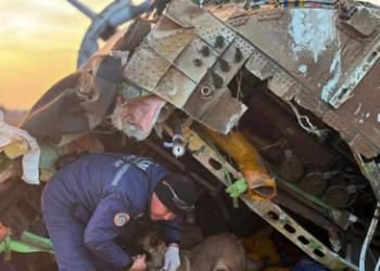 Azerbaijani airliner plane crash: A rescuer searched the wreckage of Azerbaijan Airlines' Embraer 190 lying on the ground near the airport of Aktau, Kazakhstan.(AP)