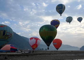 Hot air balloons rise in sky during the international festival at Pokhara in Nepal. (Photo by PRAKASH MATHEMA / AFP)